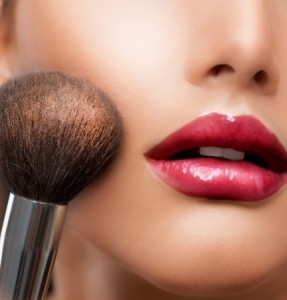 woman's face with make-up brush