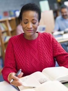 mature African American woman in studying